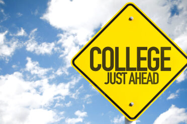 College Just Ahead sign with sky background
