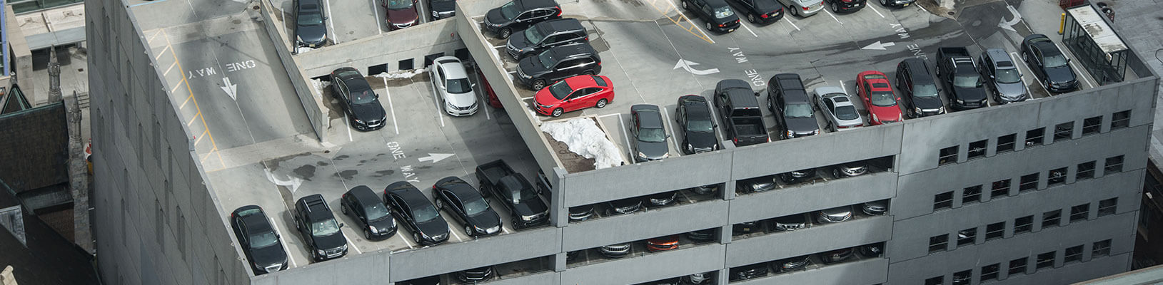 Aerial view of multi-level parking garage with cars parked